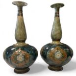 A Pair of Royal Doulton Stoneware bottle vases, blue mottled ground with floral patterns, number