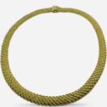 A 14K mesh collar necklace. In yellow precious metal which tests as 14K yellow gold. With box