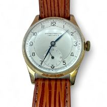 A 1950s wristwatch in a 9ct gold case. Silvered dial, signed Winegartens Ltd, London E.C. 2, with