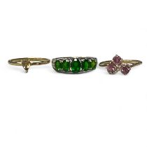 A trio of Gemporia 9ct gold gem set rings. Featuring a chrome diopside and diamond half hoop ring in