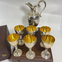 A Modern commemorative silver ewer and 6 goblets by Garrard and Co.  Celebrating the Silver