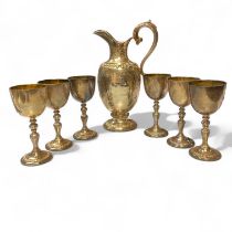 A Modern commemorative silver ewer and 6 goblets by Garrard and Co.  Celebrating the Silver