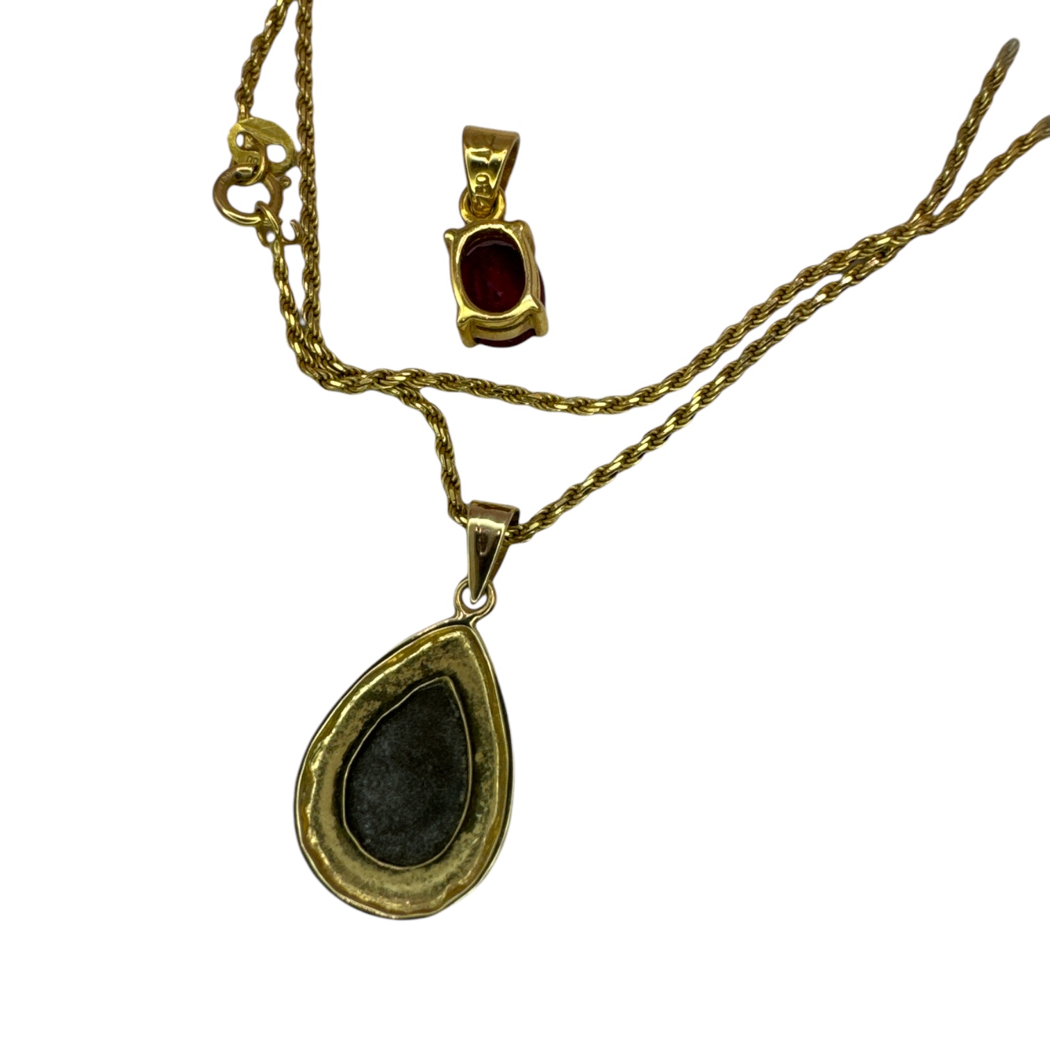 An 18ct yellow gold chain with two pendants, one a flux synthetic ruby stamped 750 and testing as - Image 2 of 2