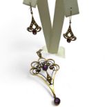An early 20th century amethyst and seed pearl lavalier pendant, stamped "9ct" on a 9ct chain;