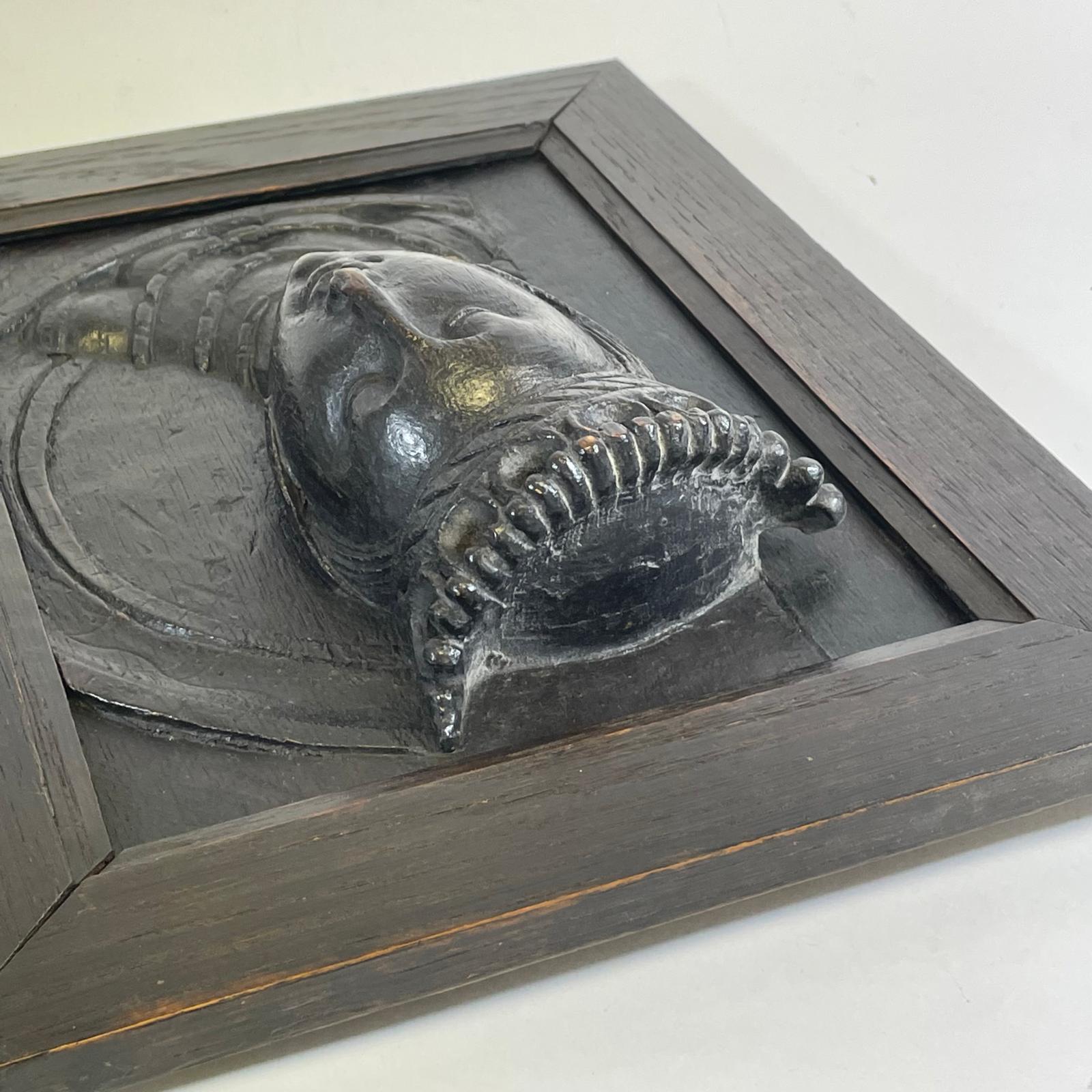 A early oak carved panel of a queens head with a replacement piece and later framed surround 28cm - Image 2 of 5