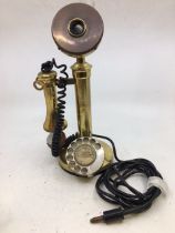 A vintage bronze stick telephone (a/f)