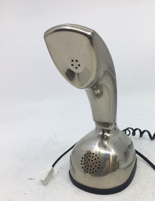 A vintage silver telephone