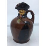 A Royal Doulton Dewars Kingsware figural jug, "The Nightwatchman", with silver and cork stopper,