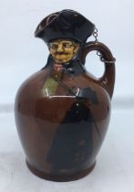 A Royal Doulton Dewars Kingsware figural jug, "The Nightwatchman", with silver and cork stopper,