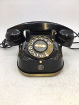 A vintage black bell telephone with Ericsson handset