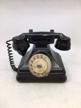 A vintage black bell telephone (a/f)