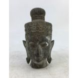 An Asian bronze figure of a head of a deity. H:11cm