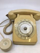 A vintage white bell telephone
