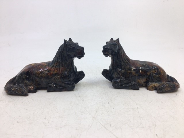 A pair of small Chinese carved stone figures of horses (2)