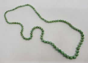 A string of graduated green jade beads, the largest diameter 10mm, length approx. 76cm.