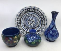 A collection of four Moorcroft art pottery too include a rare design plate  and four vases. H: