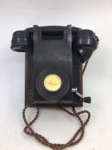 A vintage black bell telephone