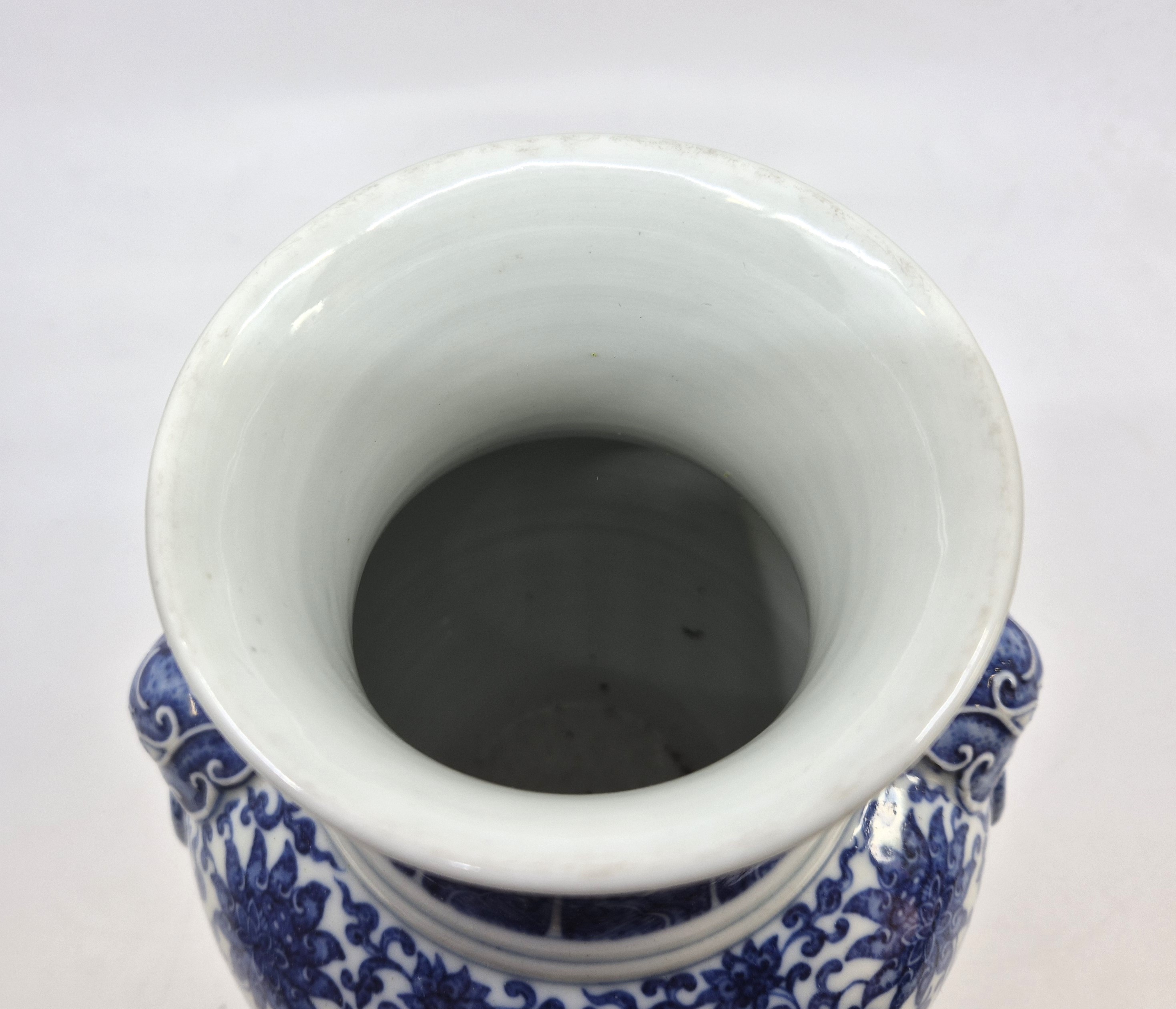 A Chinese blue and white twin-handled Zun vase, height 23.8cm, together with a stand.  Condition - Image 6 of 8