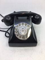 A vintage G.E.D. black bell telephone.