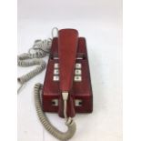 A vintage telephone with read leather cover, (TELE. SR. 1016A, S.T.C. 80/1)