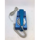 A vintage blue telephone