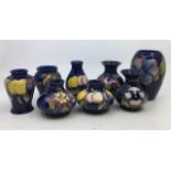 A collection of eight Moorcroft art pottery  vases. H:13cm (tallest) (8)