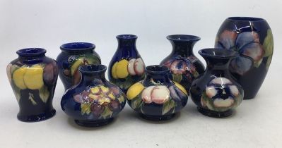A collection of eight Moorcroft art pottery  vases. H:13cm (tallest) (8)