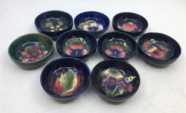 A collection of nine small Moorcroft art pottery bowls, diameter: 8cm (9)