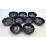 A collection of nine small Moorcroft art pottery bowls, diameter: 8cm (9)