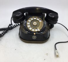 A vintage black bell telephone (MFG)