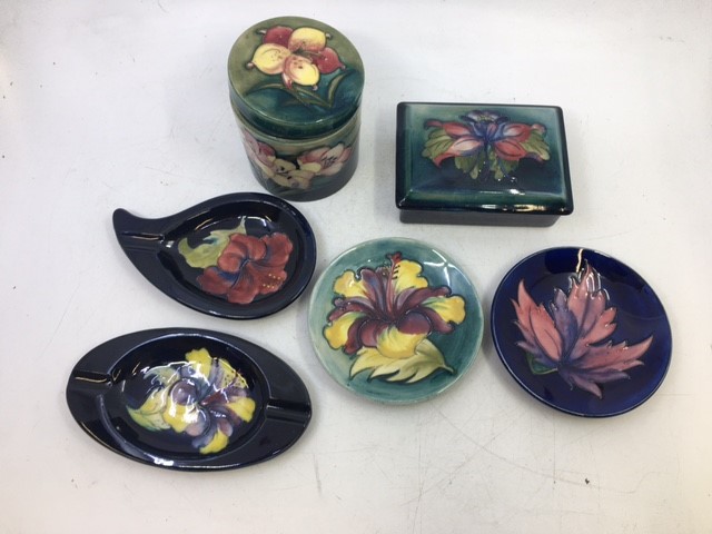 A collection of six Moorcroft pottery to include a lidded jar, a lidded box, and four plates. (6) - Image 2 of 3