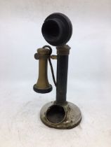 A vintage black stick telephone (a/f)