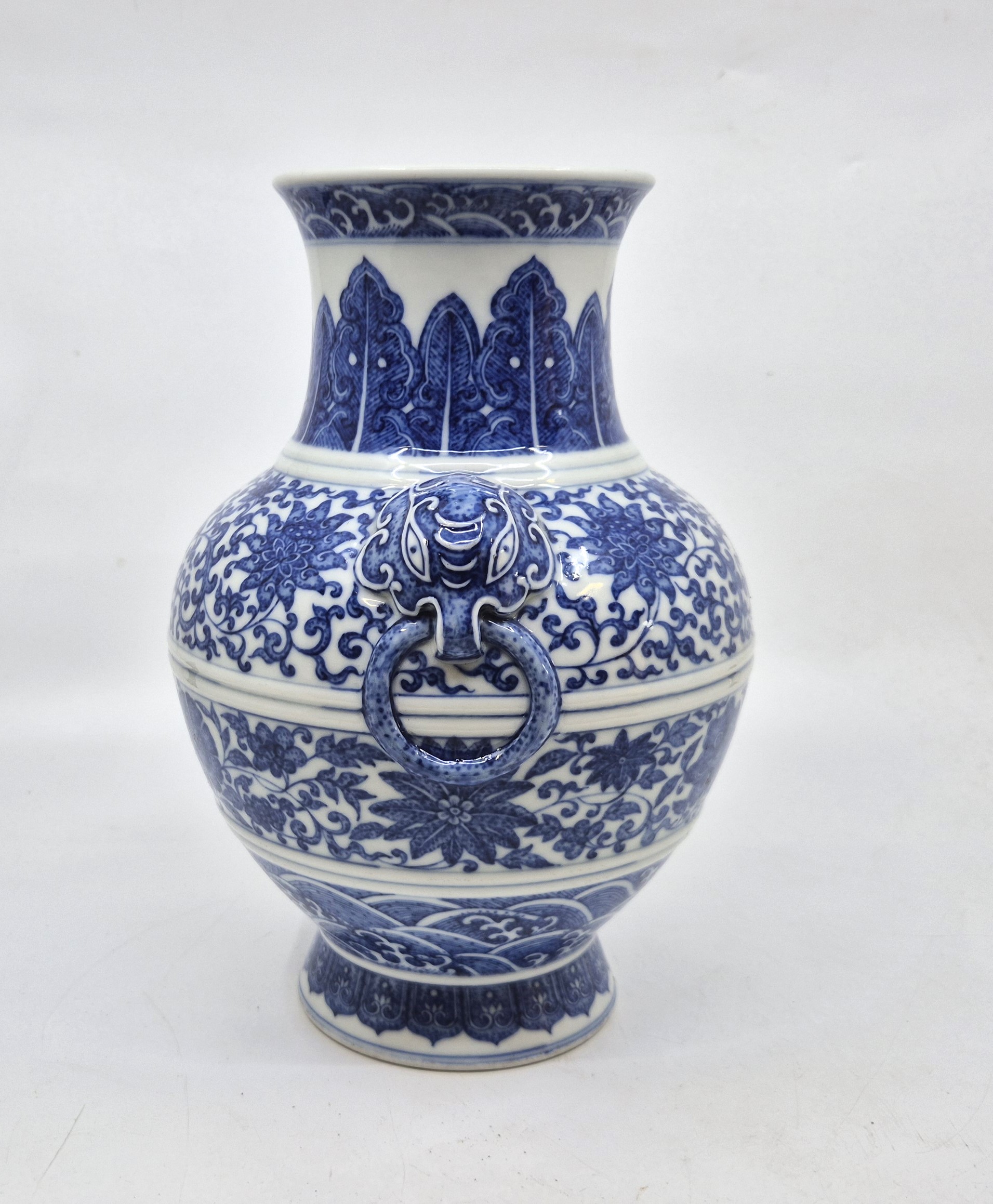 A Chinese blue and white twin-handled Zun vase, height 23.8cm, together with a stand.  Condition - Image 8 of 8