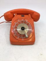 A vintage orange telephone