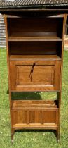 An arts and crafts bookcase with  chequered banded inlay