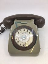 A vintage green bell telephone (TELE 8746 G, B.T. QC/CCF, BATCH SAMPLED FWR 83/1)