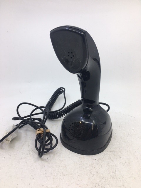 A vintage black telephone