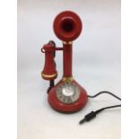 A vintage red stick telephone. (serial no: 009149) (TSR 1005, TYPE B, STC 81/1)