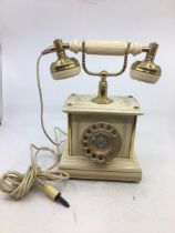 A vintage white telephone, (serial number: 05545)