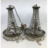 A pair of crystal chandeliers. A/F