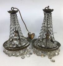 A pair of crystal chandeliers. A/F