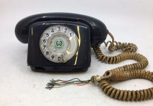 A vintage black telephone (TELEPHONE, 2/SA 4271, PO FDJ, BATCH SAMPLED FWB 77/1)
