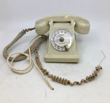 A vintage white bell telephone (ST PLAZLLES, APPREIL A.B.C., TYPE U. 43, No: 112/82)