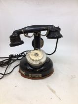A vintage black bell telephone, (MARCHE DU 21/2/28, LOT 20) (APPREL MOBILE B.C.I., M.O.D 1924) )
