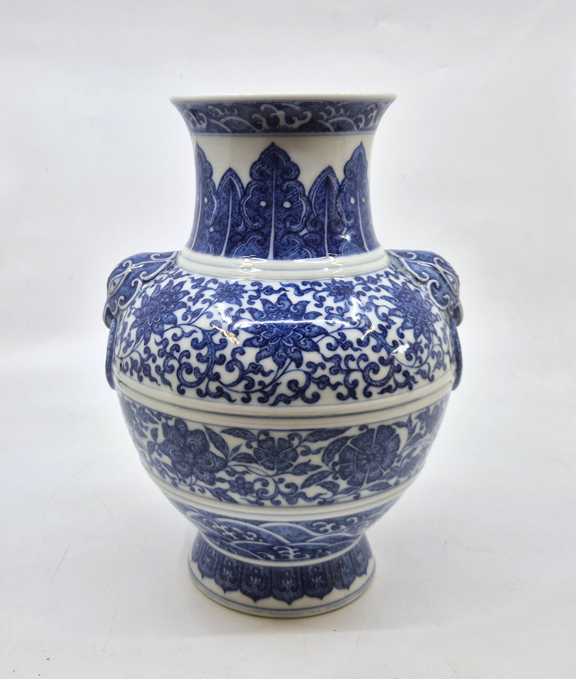 A Chinese blue and white twin-handled Zun vase, height 23.8cm, together with a stand.  Condition - Image 7 of 8