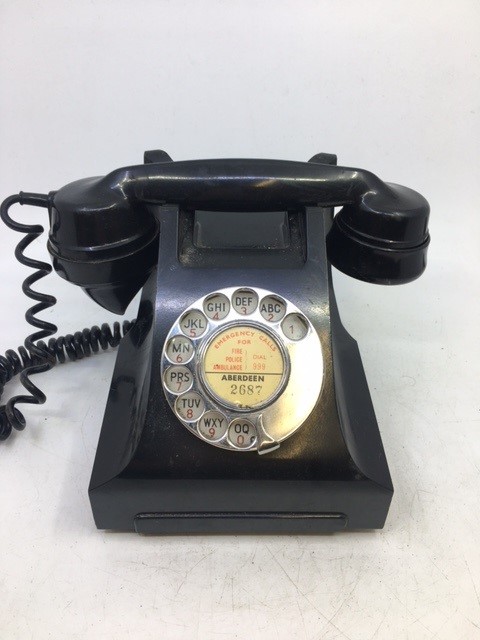 A vintage black bell telephone, (164 - 46/1), (332L, G.P.O., F.D.I., BATCH SAMPLED FWR66/2)