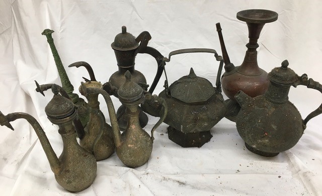 A large collection of Indian metal jugs tother with a rose water sprinkler (some a/f)