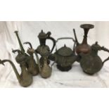 A large collection of Indian metal jugs tother with a rose water sprinkler (some a/f)