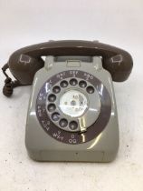 A vintage telephone (706L, G.P.D., F.D.J., BATCH SAMPLED FWR 68/2A)