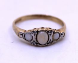9ct Yellow Gold Cabochon Opal and Ilusion Set Diamond Ring.  The centre Oval Cabochon Opal
